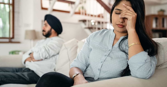 Upset man and woman on the couch