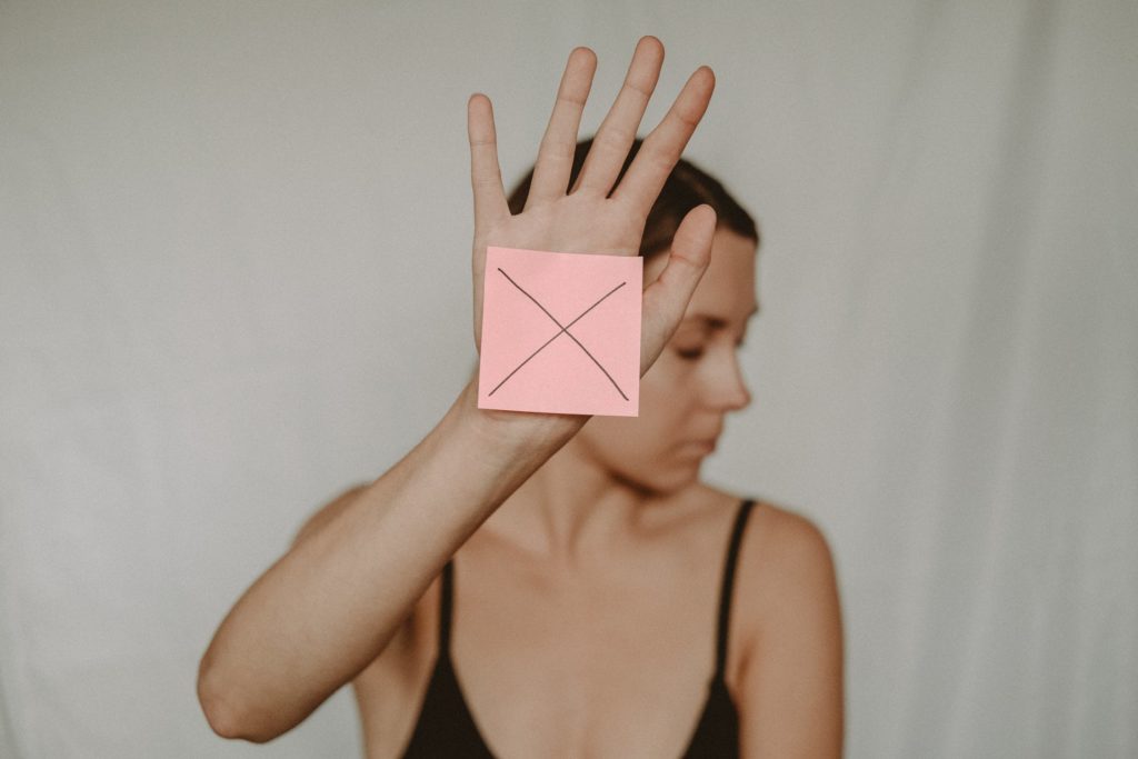 woman with sticky note on her hand