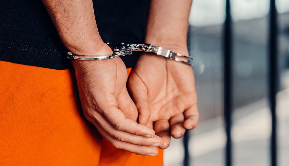 man wearing handcuffs