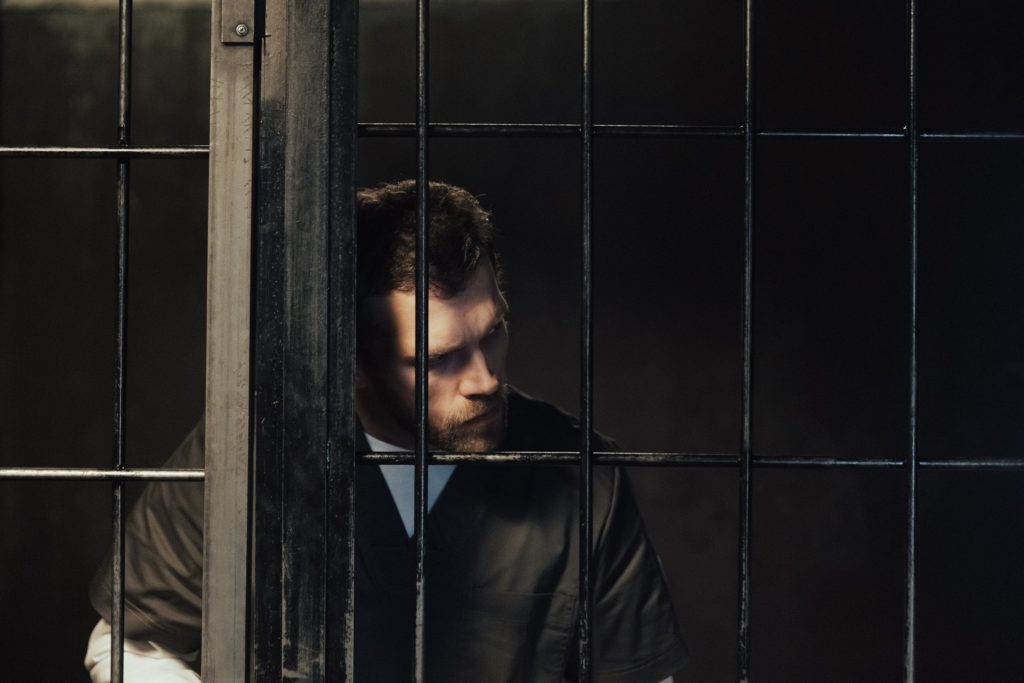 sad man in jail