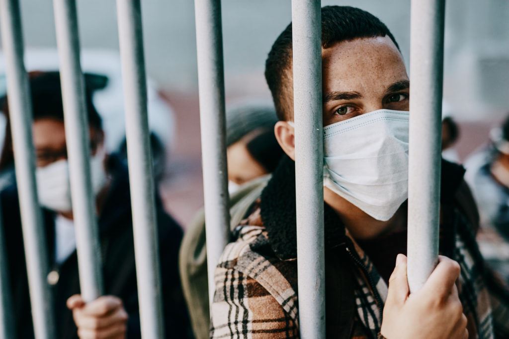 A photograph of an immigrant in detention after arrest.