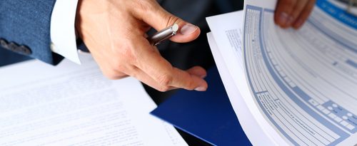 man looking through papers