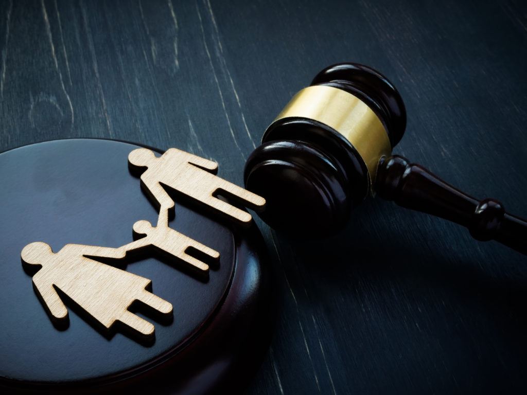 photograph of family character cutouts, and a judge's gavel.