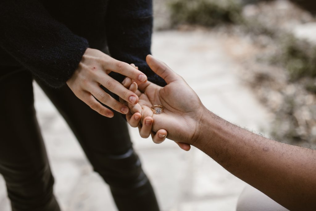 woman giving back wedding ring