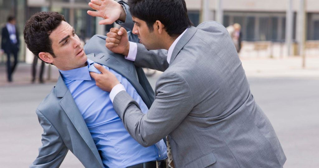 two men in suits fighting