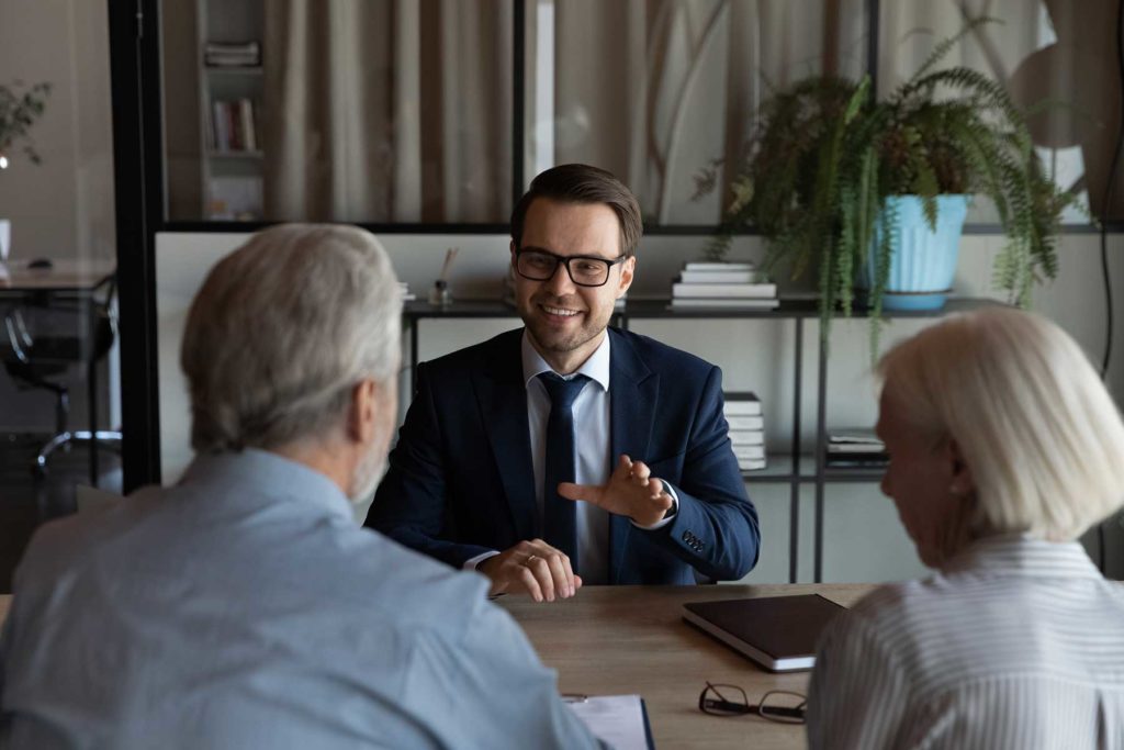 lawyer talking to elderly couple