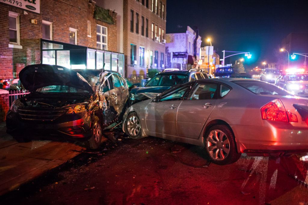 Photograph of a car accident involving 3 cars.